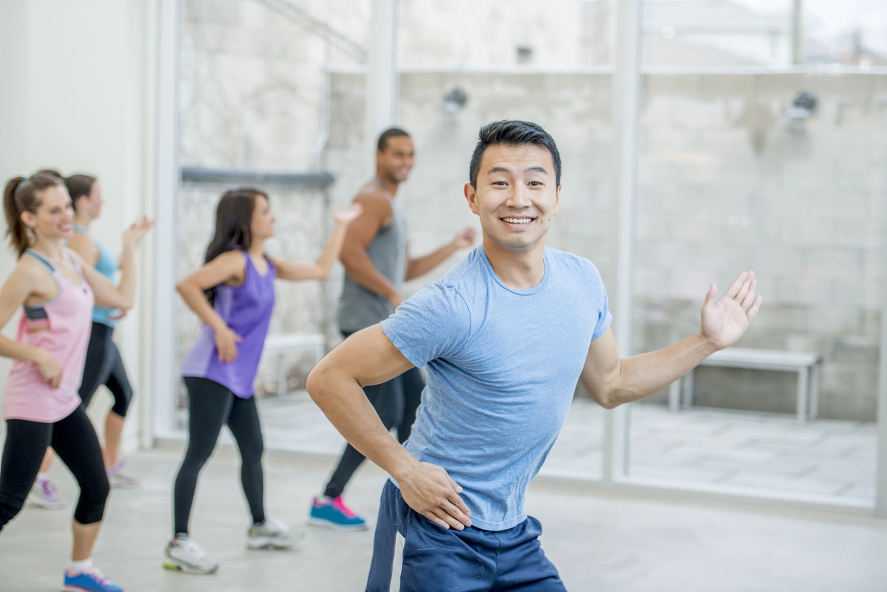 asian man smiling during workout